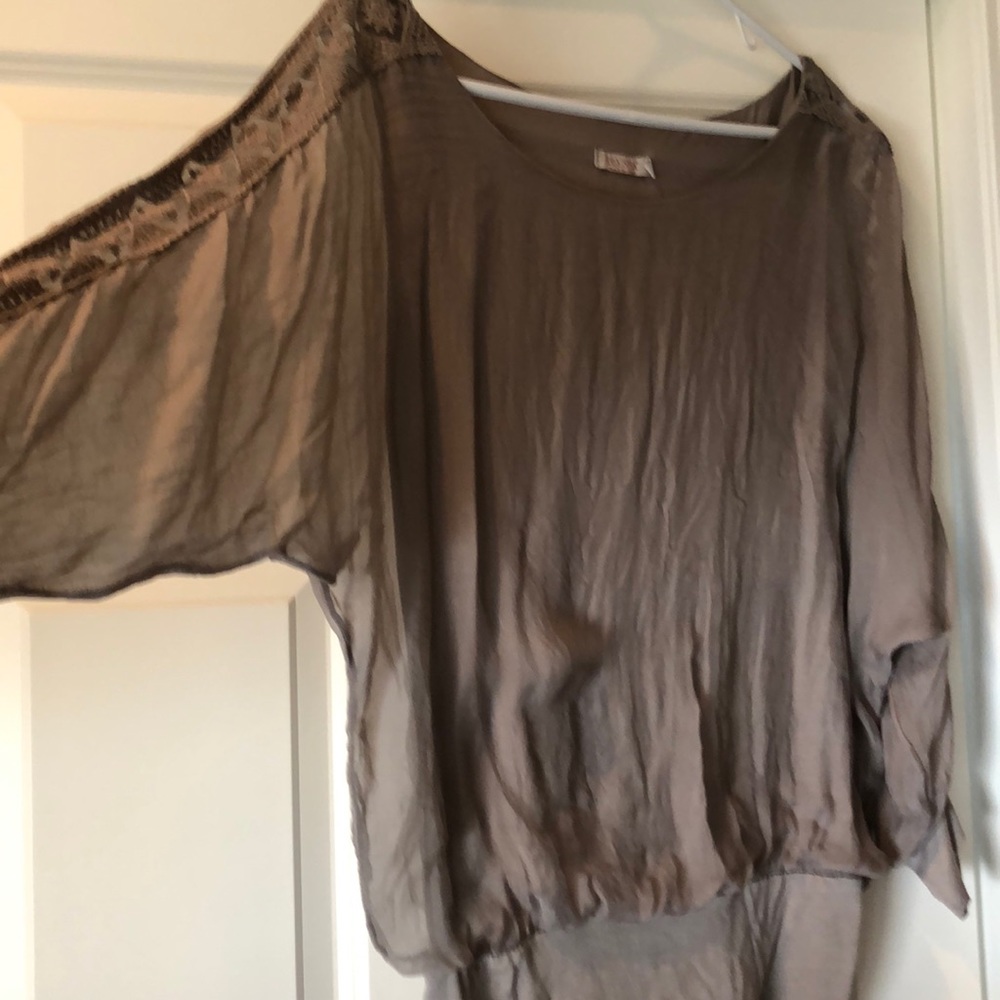 Sheer blouse. Very pretty.
